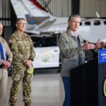 Governor Gavin Newsom speaking inside Coast Air Center hangar at Montgomery-Gibbs Executive Airport San Diego