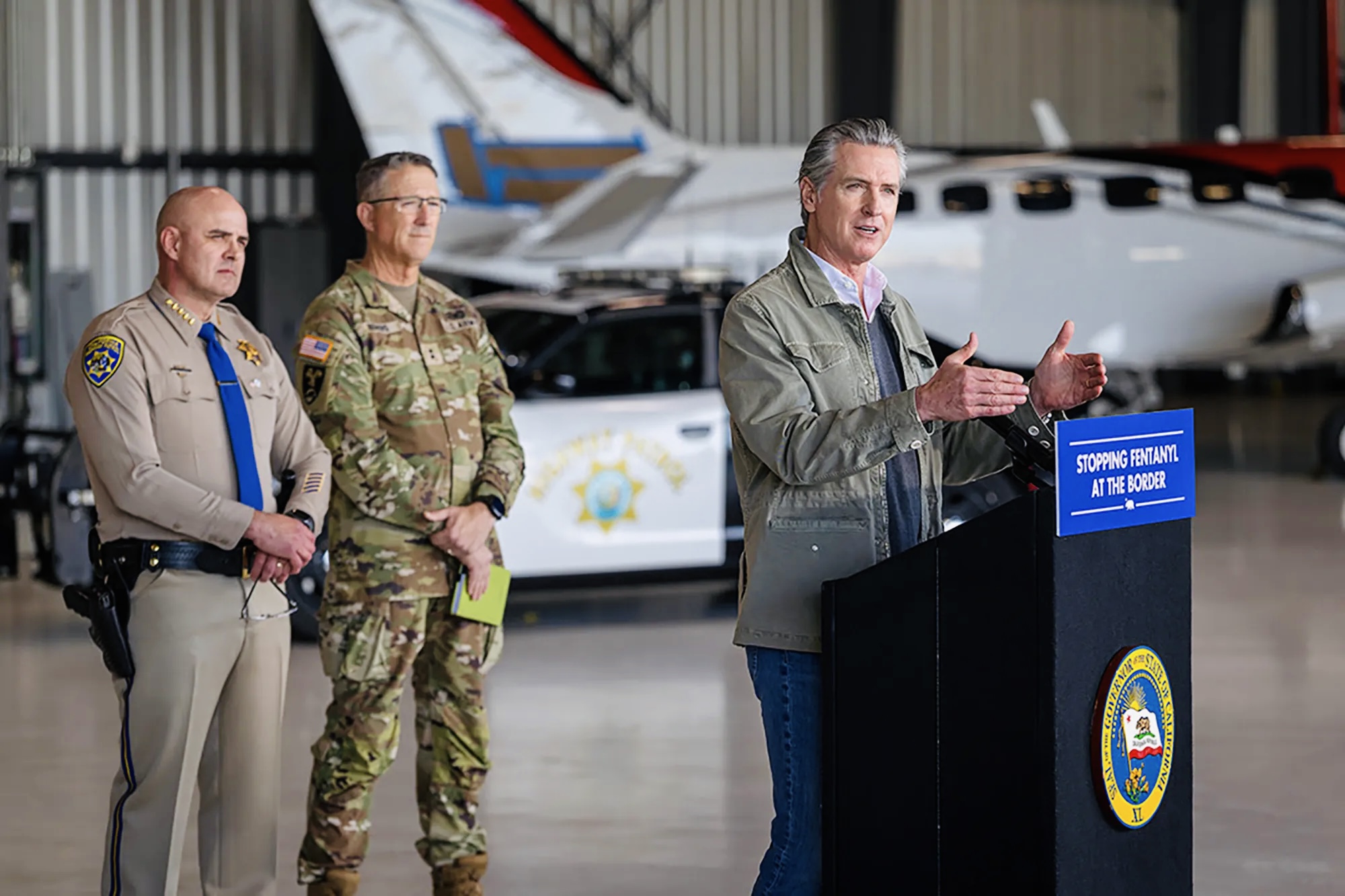 Governor Gavin Newsom speaking inside Coast Air Center hangar at Montgomery-Gibbs Executive Airport San Diego